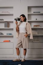 women beige bermuda pants and biker jacket by Laborio