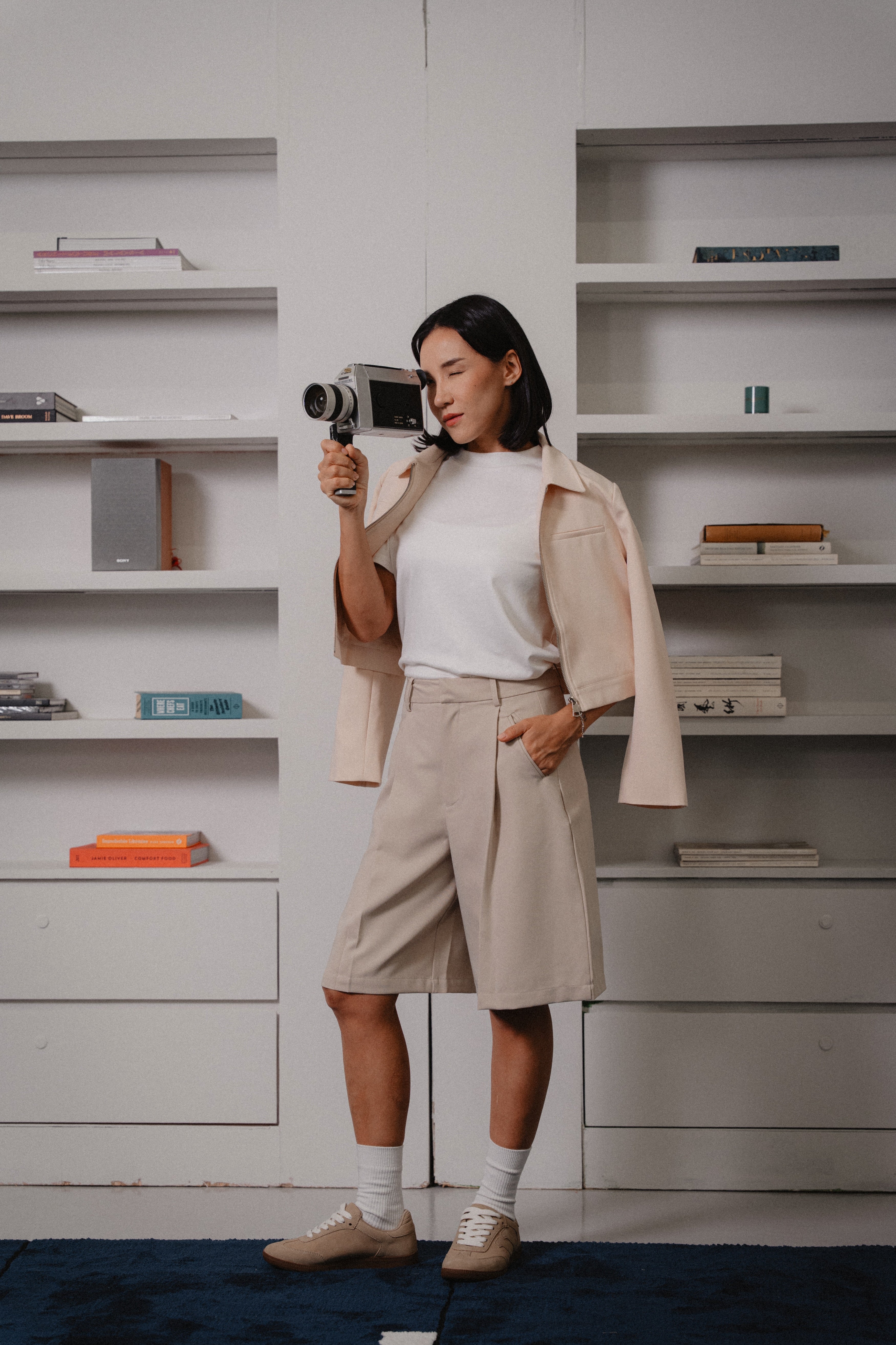 women beige bermuda pants and biker jacket by Laborio