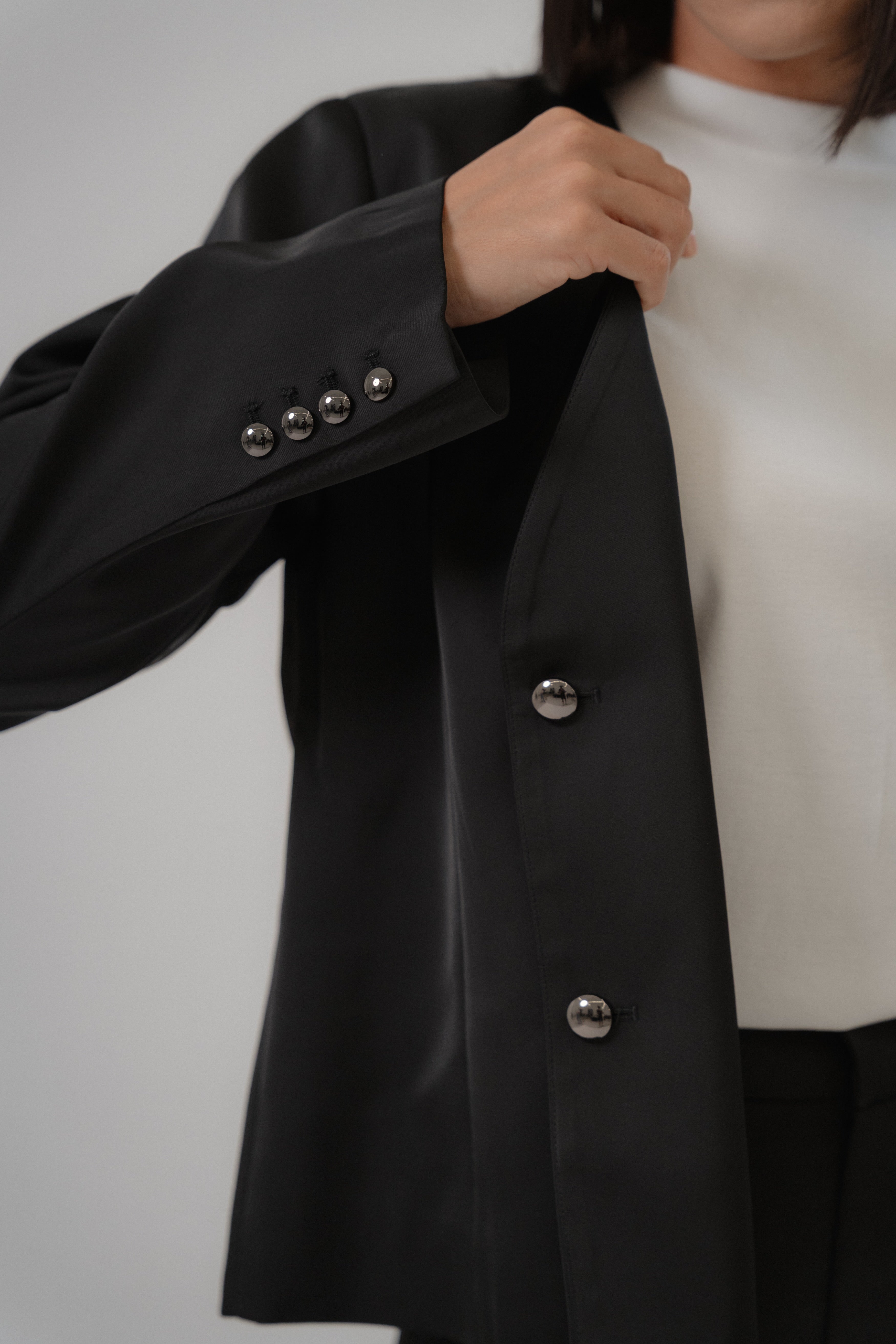 Black satin blazer with metal button