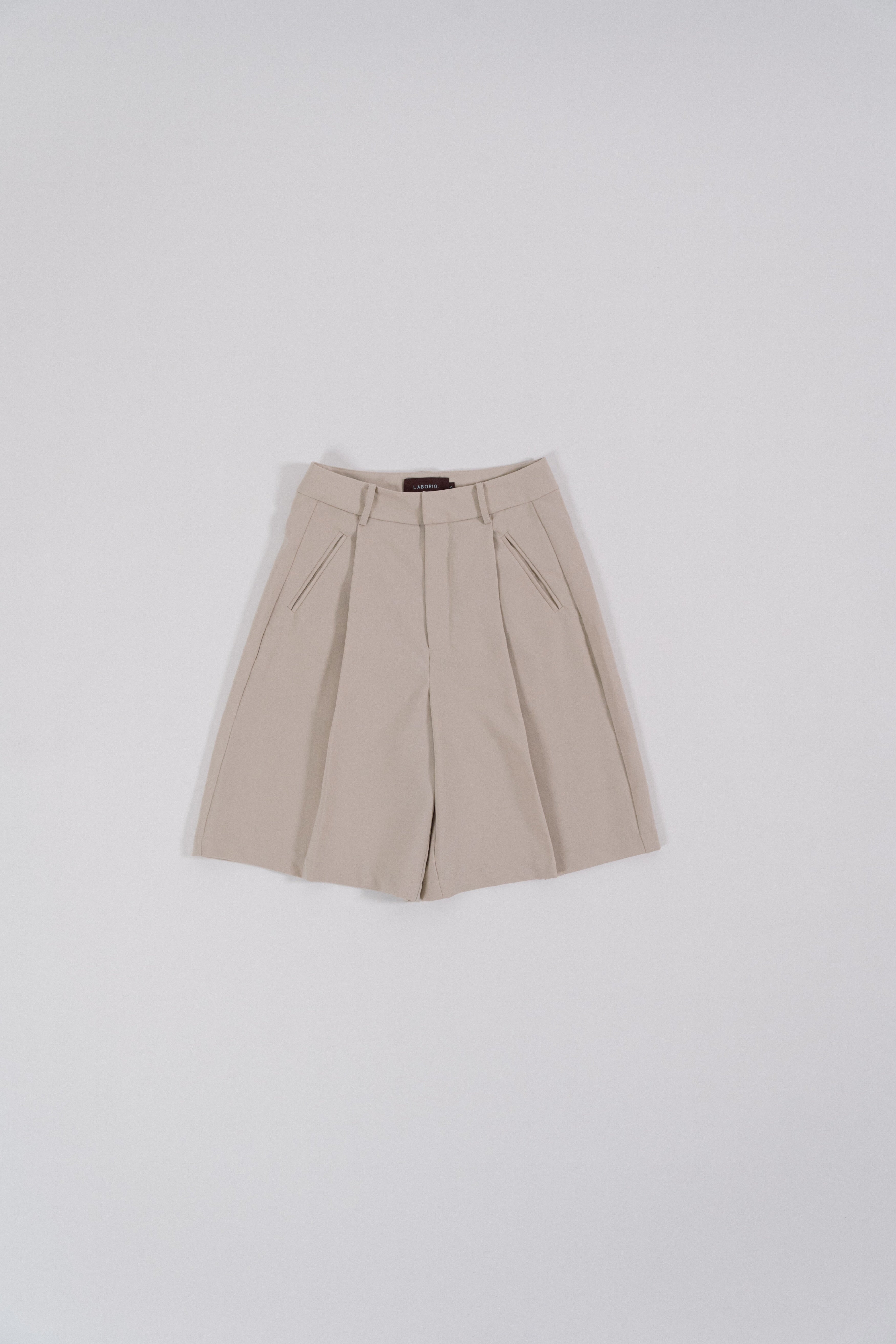 beige bermuda pants lay flat