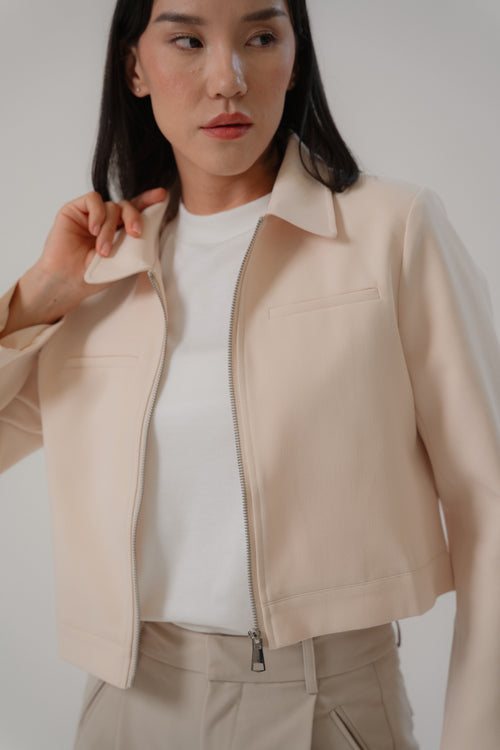 women wearing a beige biker jacket with full zip, regular fit, design for daily city wear