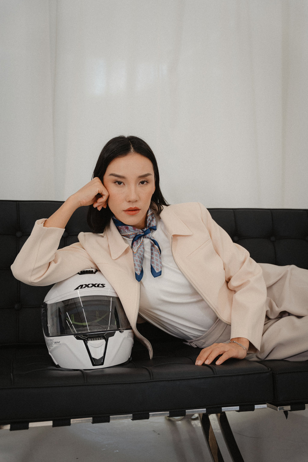 women wearing a beige biker jacket with full zip with modern silhouette, regular fit design for daily city wear