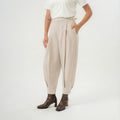 beige cross pleated long pants with balloon sillhouette for daily office wear