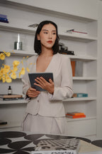 women wearing beige tailored blazer with modern silhouette, design for office and city wear