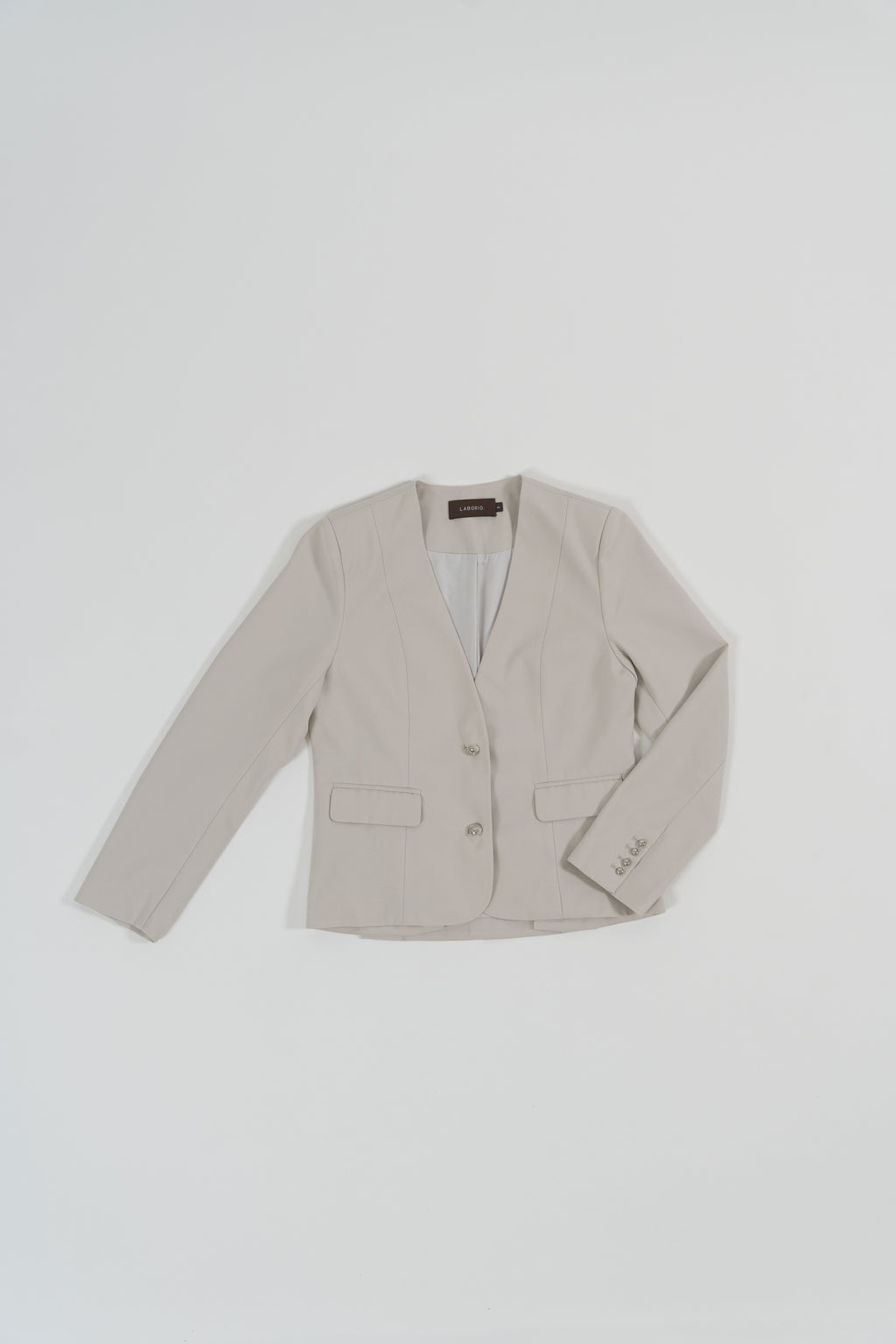 beige tailored blazer with modern silhouette, design for office and city wear