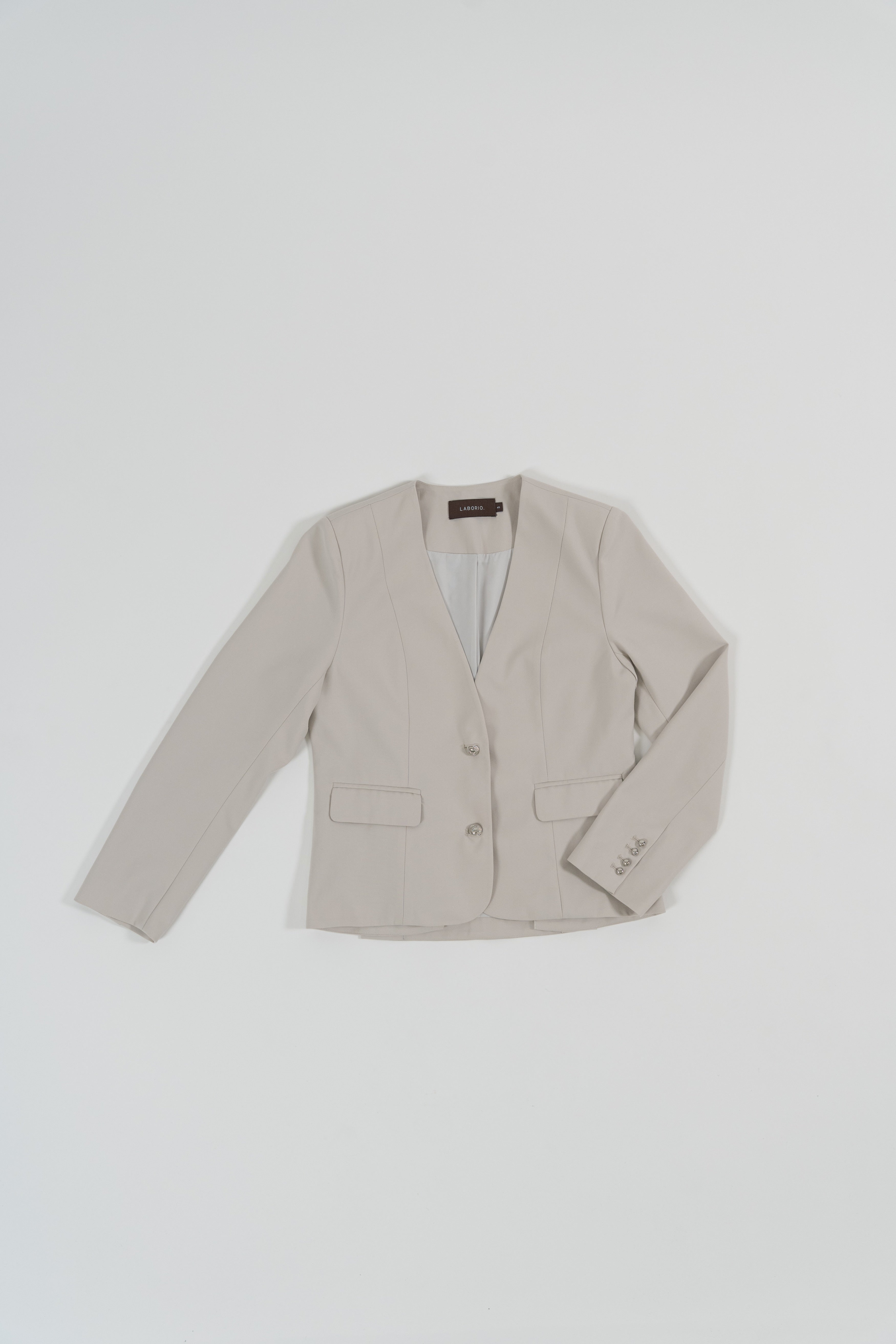 beige tailored blazer with modern silhouette, design for office and city wear