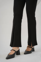 women wearing black bootcut pants with high waist silhouette, made with roman knit fabric, design for daily and office wear.