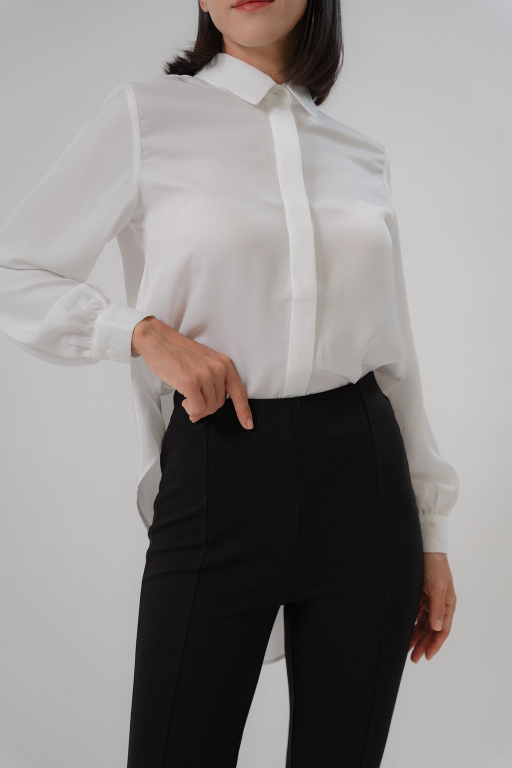 women wearing black bootcut pants with high waist silhouette, made with roman knit fabric, design for daily and office wear.