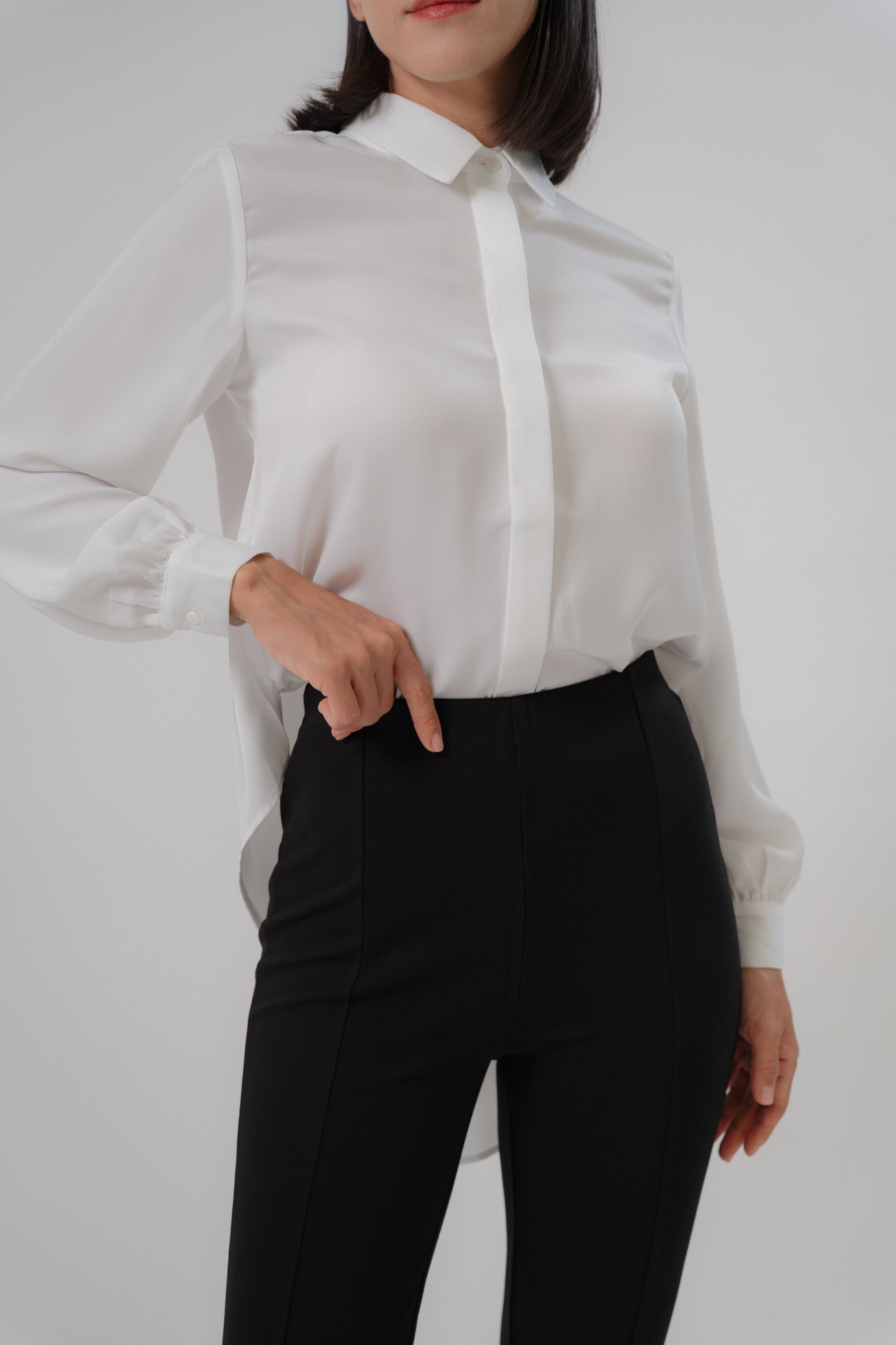 women wearing black bootcut pants with high waist silhouette, made with roman knit fabric, design for daily and office wear.