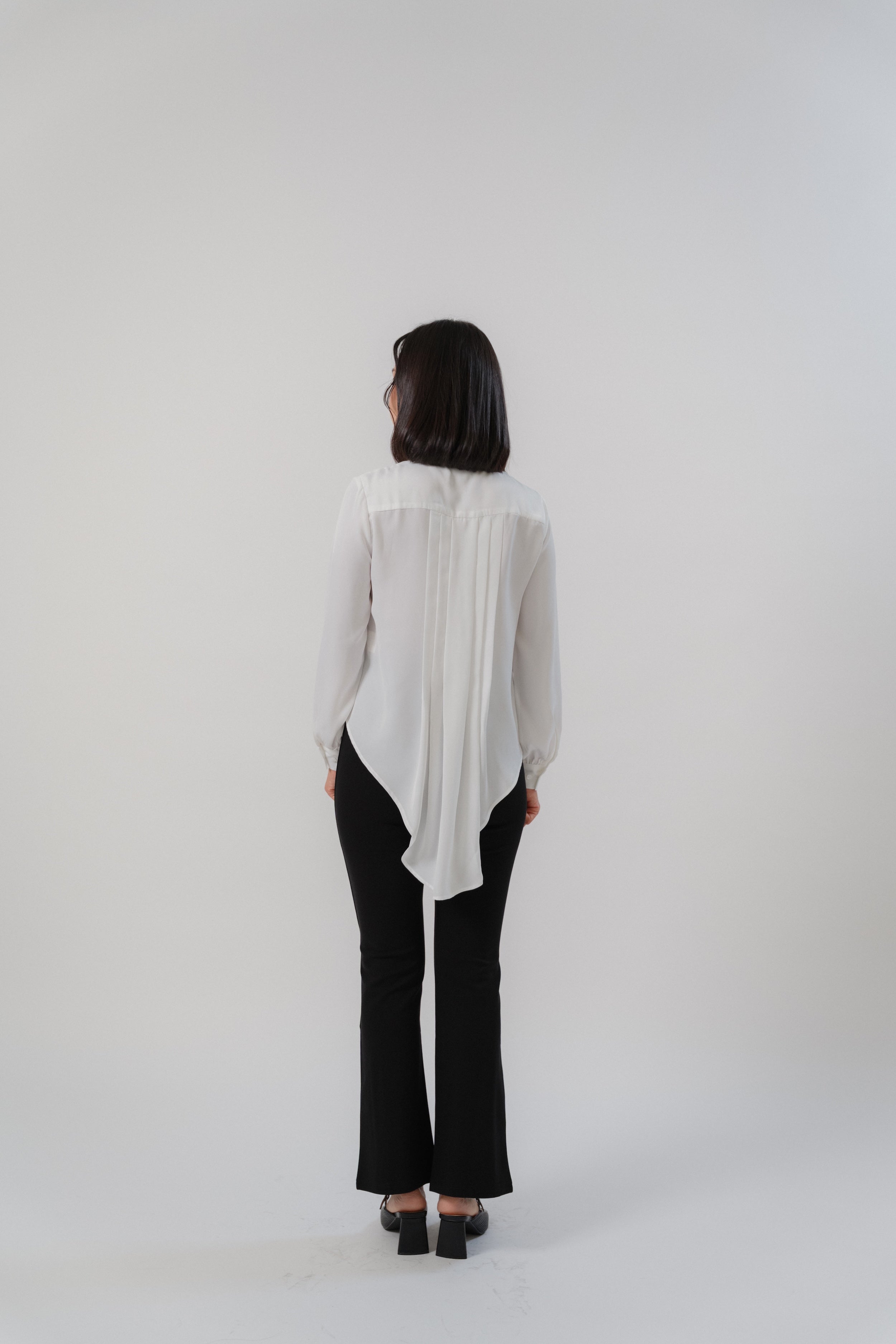 women wearing black bootcut pants with high waist silhouette, made with roman knit fabric, design for daily and office wear.