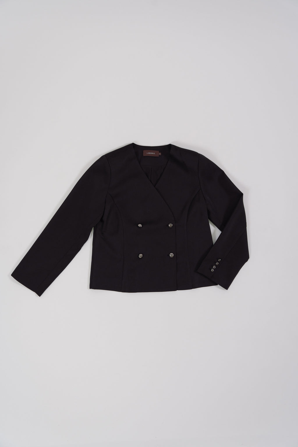 Black tailored blazer for women with a modern silhouette, designed for office and city wear.