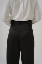 black satin pants with side slits back view