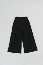 Black wide leg pants with wide leg cut, single front pleat, metal buckle straps, design for office and daily wear.