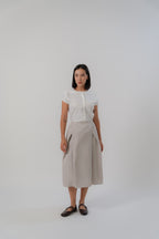 women wearing white capsleeve blouse with back flare, boat neckline, regular fit timeless design, perfect for office and daily wear