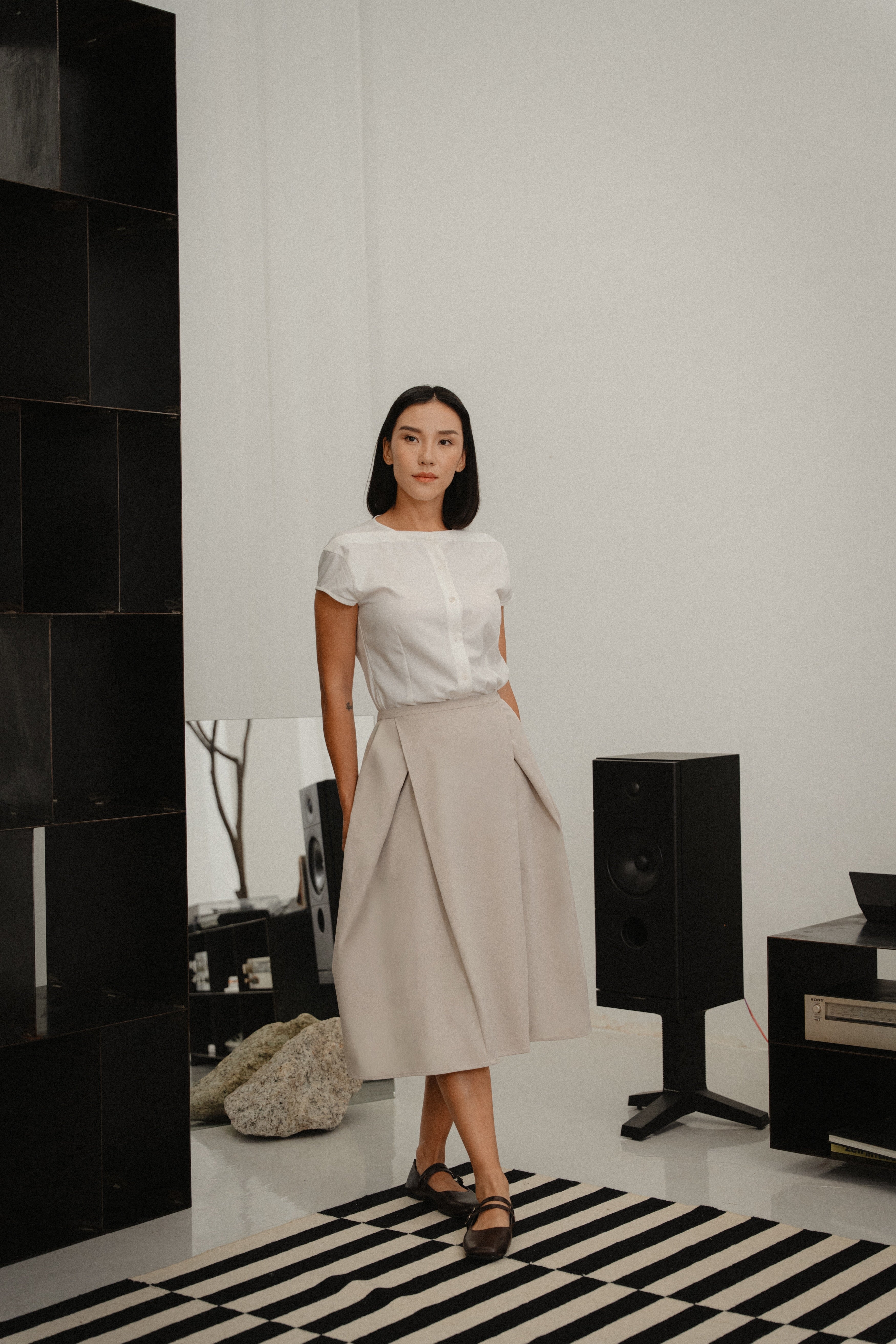 women wearing white capsleeve blouse with back flare, boat neckline, regular fit timeless design, perfect for office and daily wear