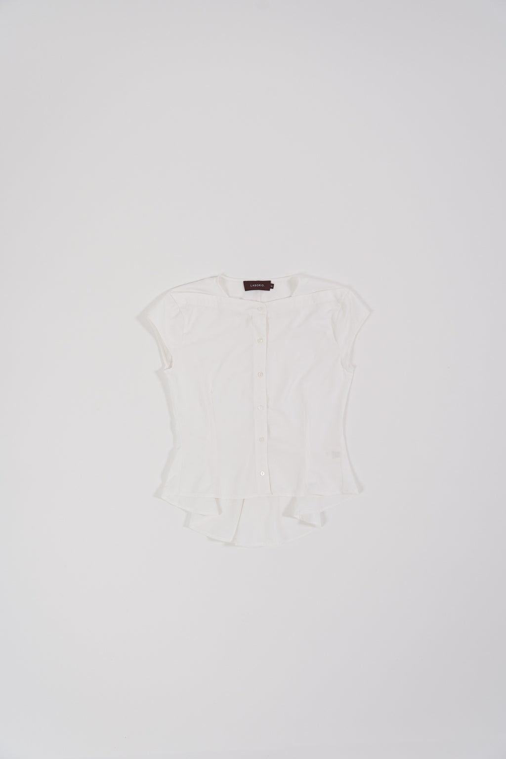 women wearing white capsleeve blouse with back flare, boat neckline, regular fit timeless design, perfect for office and daily wear