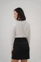 women wearing a white collared wide shoulder blouse with regular fit, design for office wear