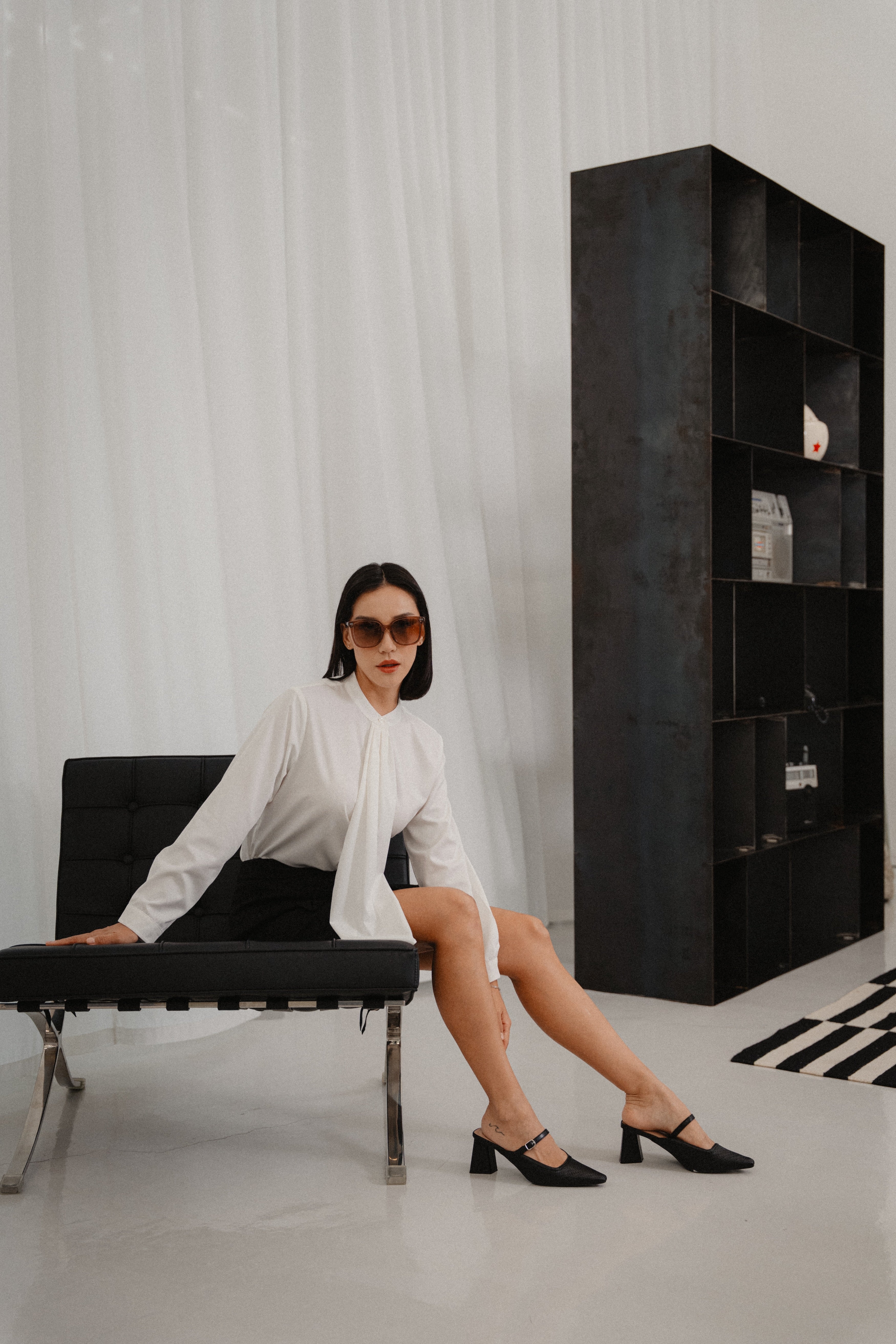 women wearing round neck collar tie blouse with classic blouse silhouette, design for office and city wear