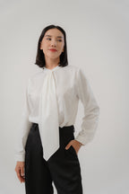 women wearing round neck collar tie blouse with classic blouse silhouette, design for office and city wear