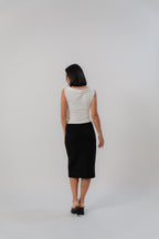 white sleeveless top with boat neckline in satin, comfortable fit, designed for women's office and city wear.